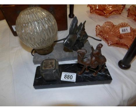 A French marble and spelter angel fish table lamp and a marble and spelter camel inkwell