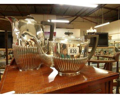 A silver plate teapot and water jug