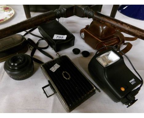 A mixed lot of vintage photographic items comprising Agfa Folding camera, Weston master light meter, flash gun, lens, Voigtla