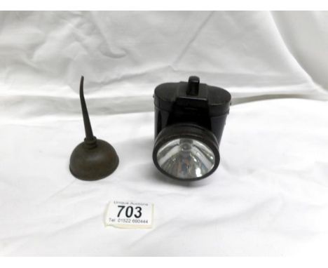 An old cycle lamp and an oil can