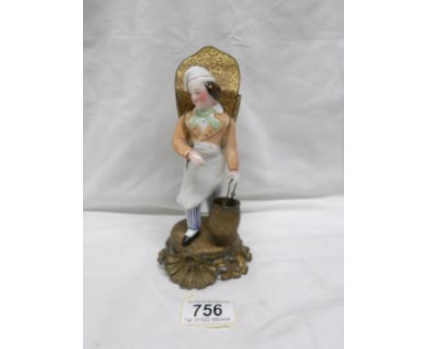 A rare metal and ceramic oriental style figure