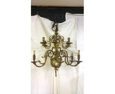 A heavy brass ceiling light