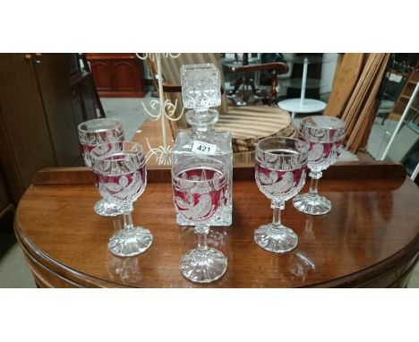 A decanter and 5 glasses