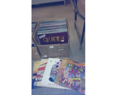 A box of classic rock LP records including Queen, Pink Floyd, Rolling Stones, Bob Dylan etc