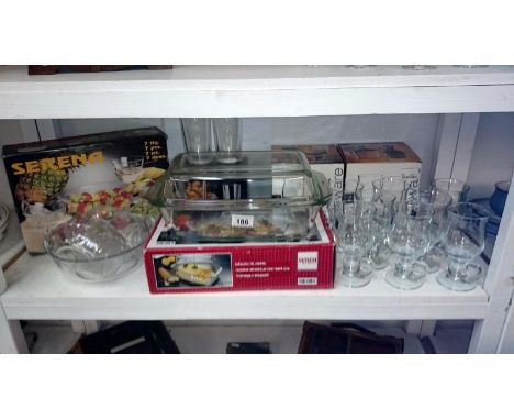 A shelf of glass ware