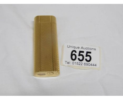 A gold plated Cartier cigarette lighter, No.126873