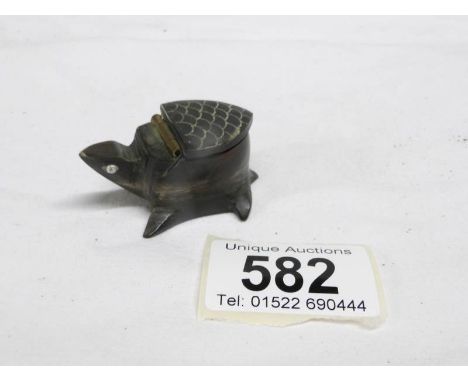 A carved horn snuff box in the shape of a tortoise
