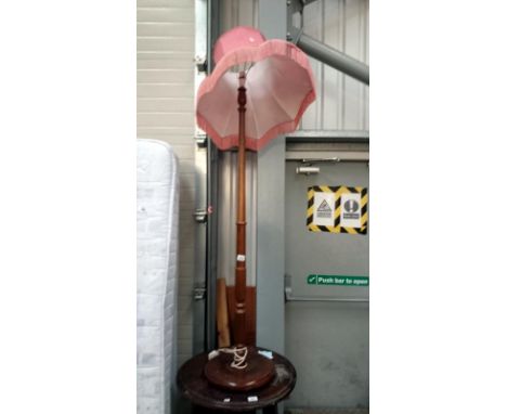 A wooden standard lamp