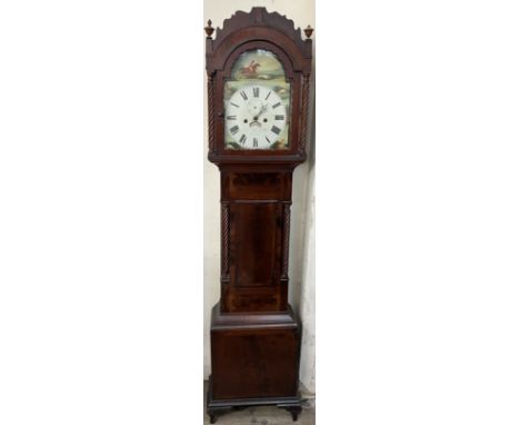 A 19th century mahogany longcase clock with an arched hood with rope twist columns and a short trunk door, box base and brack