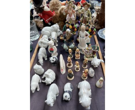 A collection of Copenhagen porcelain polar bears and pandas together with Hummel figures, Royal Doulton figures Ther Old Ball