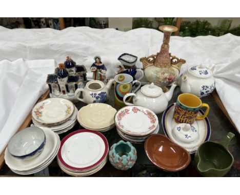 Two Staffordshire cottages together with a Doulton floral decorated twin handled vase, assorted saucers etc 