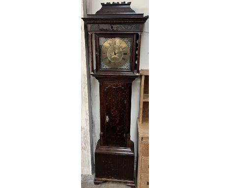 A mid 18th century oak longcase clock, the hood with a caddy top above a painted frieze and Ionic columns, with a shaped long