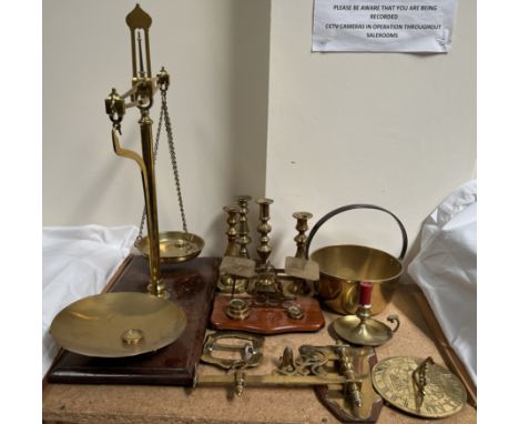 A brass balance beam scales together with brass candlesticks, brass letter scales, brass sundial, cauldron, etc 