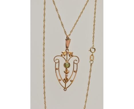 AN EDWARDIAN PENDANT AND CHAIN, open work floral pendant, set with a circular cut peridot, missing dropper, fitted with a tap