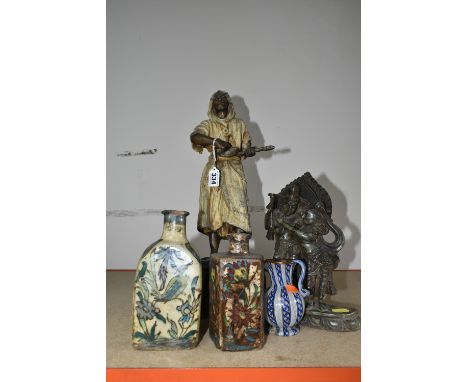 TWO FLORAL PERSIAN QAJAR POTTERY TEA FLASKS, A CARVED SOAPSTONE FIGURE OF TWO EASTERN DEITIES, A SPELTER FIGURE OF A MIDDLE E