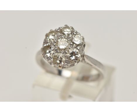 AN 18CT WHITE GOLD DIAMOND CLUSTER RING, set with seven round brilliant cut diamonds, estimated total diamond weight 1.40cts,