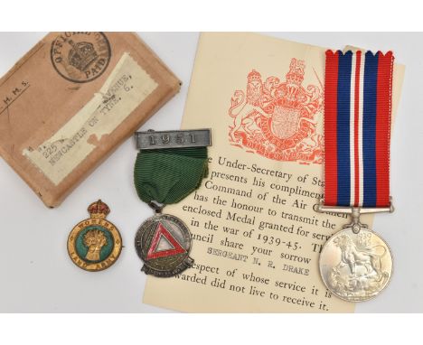 A WWII MEDAL AND OTHERS, unassigned WWII medal with a red, blue and white stripe ribbon, with box, a Drivers Award fob medal 