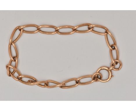 A YELLOW METAL CURB LINK BRACELET, each link stamped 15.625, fitted with a bolt spring clasp, length 210mm, approximate gross