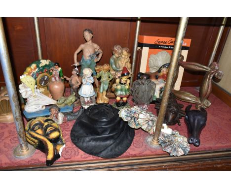 A GROUP OF CHALKWARE AND OTHER FIGURES, comprising a carved stone deer skull (broken horn), a cast iron doorstop 'Please Lord