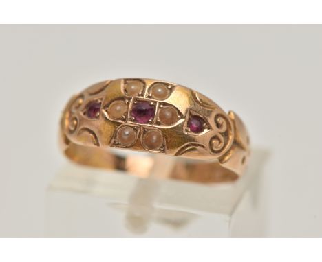 A LATE VICTORIAN 15CT GOLD RUBY AND PEARL RING, flower detail to the centre set with a central ruby within a surround of spli