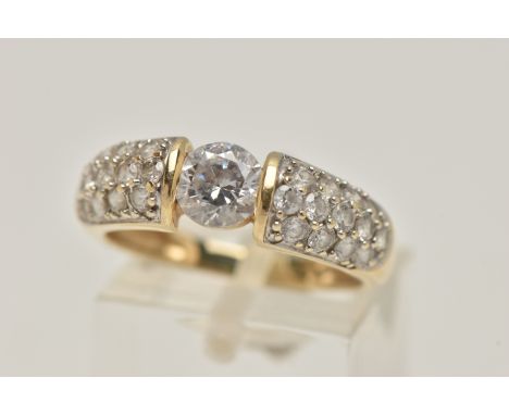A 14CT GOLD CUBIC ZIRCONIA RING, designed as a central circular colourless cubic zirconia flanked by thirteen circular cubic 