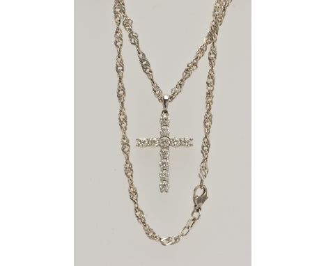 A WHITE METAL DIAMOND CROSS PENDANT AND A CHAIN, the cross pendant claw set with eleven round brilliant cut diamonds, estimat