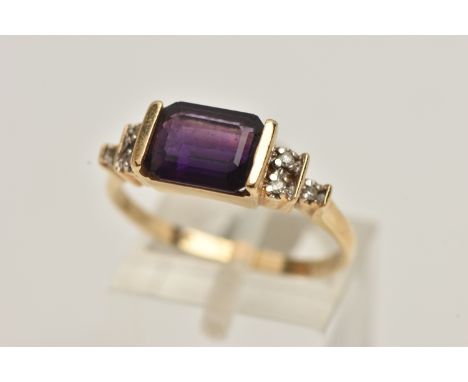 AN AMETHYST AND DIAMOND DRESS RING, rectangular cut deep purple amethyst, half bezel set leading on to stepped shoulders, set