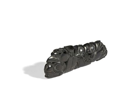 HAIDA PIPE NORTHWEST COAST, NORTH AMERICA 17.5cm longcarved argillite, with various figures carved across the stem  Provenanc
