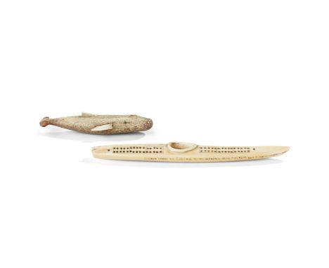 PAIR OF INUIT SCULPTURES ALASKA longest 26cmmarine bone and ivory, one whale figure, one marine ivory kayak cribbage board wi