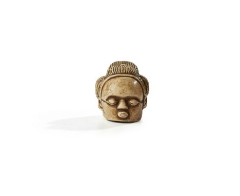 LUBA CUP DEMOCRATIC REPUBLIC OF THE CONGO 7.5cm diametercarved bone, with coffee bean eyes, open mouth, protruding tongue and