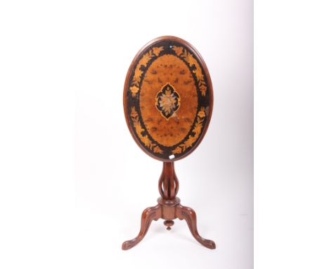 An unusual 19th century small tripod table with oval inlaid walnut top on a eight column pedestal divided at the base on a tr