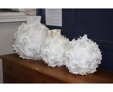Origami: three folded paper hanging light shades, a pair of approx diameter 36cm and one larger approx 46cm