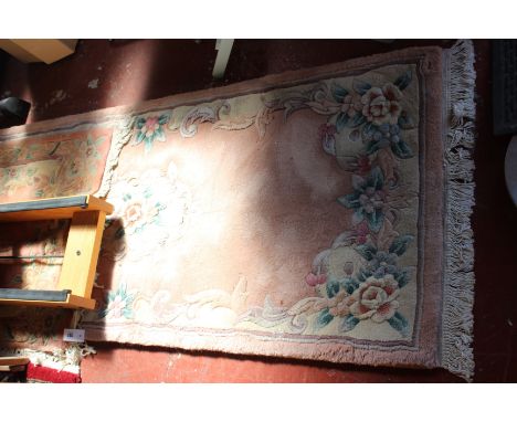 A washed wool Chinese runner, pink ground (67cm x 370cm) and a similar rug