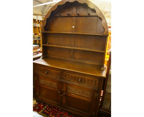 An oak arch top dresser with open shelf back, 122cm wide