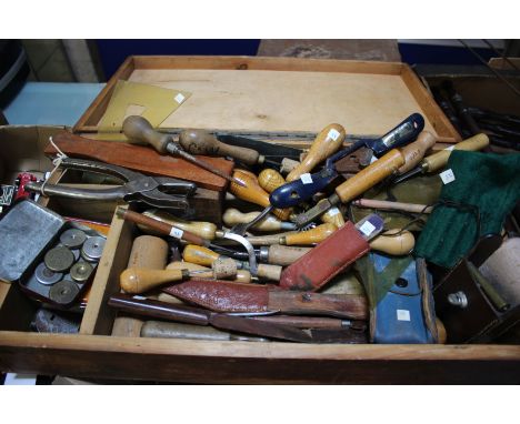 Leather working tools: a box containing specialist knives, punches, creasers, spoke shave, etc., approximately forty tools wi