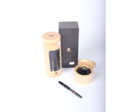 Pens: a Namiki lacquer cartridge pen with 18ct nib and flying crane decoration, with inkwell, both with good beech cylindrica