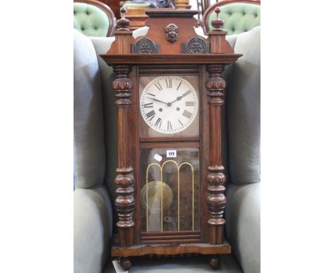A Victorian style Vienna wall clock with two train movement and mahogany case with top and bottom mouldings, 88cm high