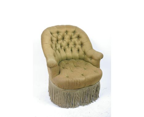 A Victorian style button upholstered armchair and an Edwardian overmantel mirror with carved pilasters, 107cm wide