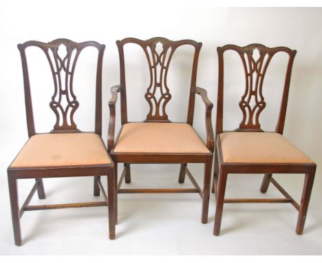 A set of six mahogany dining chairs in George III style, including two armchairs, together with two ladder back dining chairs