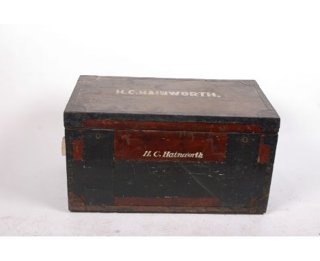 A metal bound trunk bearing initials H.C Hainworth 55cm high, 100cm wide  