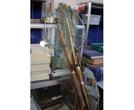 A collection of vintage fishing rods, keep net, etc