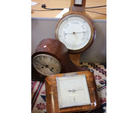 Three aneroid barometers and a 1940's mantel clock
