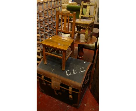 A Victorian leather bound arch top trunk (62cm wide), two children's chairs both early 20th century and a pillar wine table