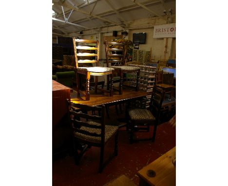 An oak refectory dining table with set of four matching ladder back chairs