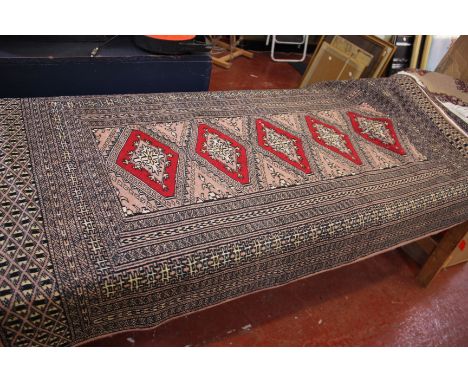 A Middle Eastern runner with deep border 90 x 165cm, a similar smaller example and a further Middle Eastern rug 