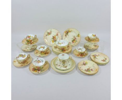 A Royal Worcester blush ivory part tea service, painted with coloured flowers, puce printed marks, together with a Crown Devo