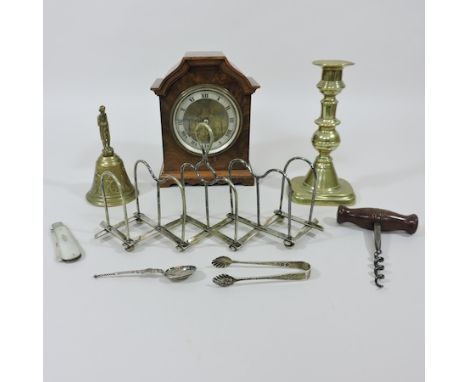 An early 20th century walnut cased mantel clock, 18cm tall, together with a silver and mother of pearl fruit knife, tongs and