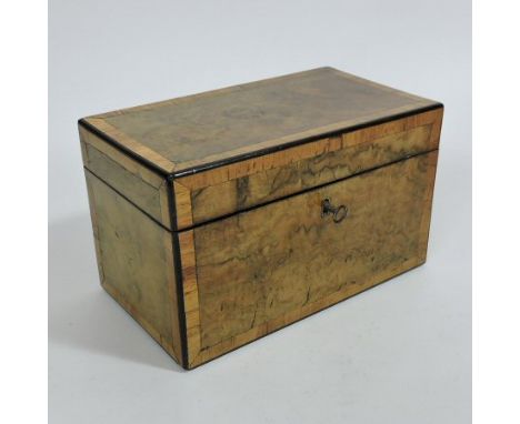 A George III burr walnut, rosewood crossbanded and ebony strung tea caddy, of plain rectangular shape with a compartmented in