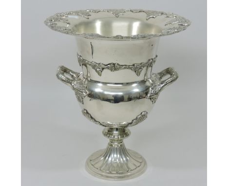 A plated wine cooler, in the form of an urn, relief decorated with grapes, 35cm tall