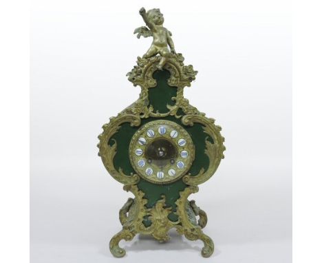 An early 20th century French Rococo style faux shagreen and gilt metal mounted mantel clock, surmounted by a cherub, 41cm tal